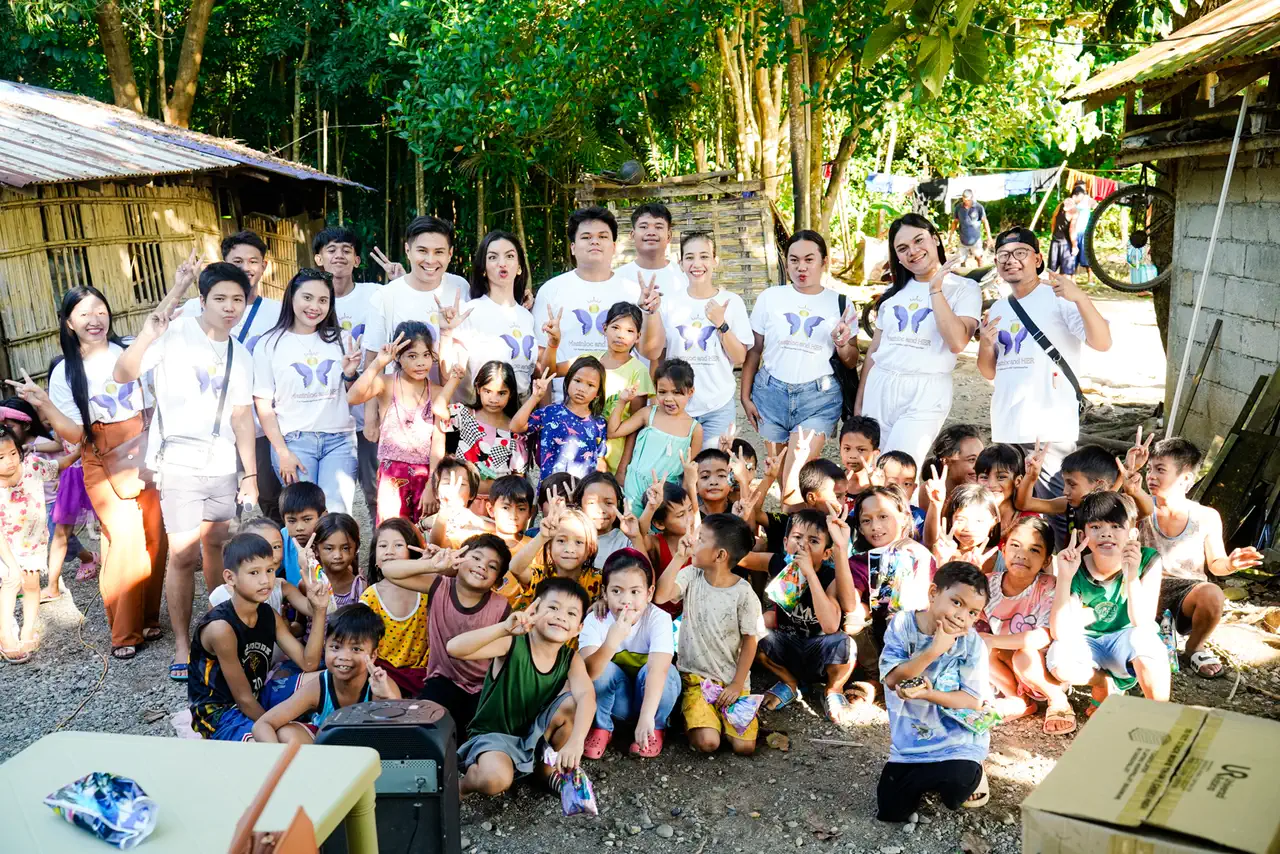 Volunteers and community members gathered together after a service activity